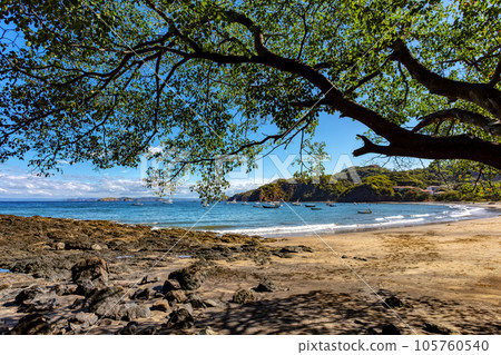 Playa Ocotal and Pacific ocean waves on rocky shore, El Coco Costa Rica 105760540