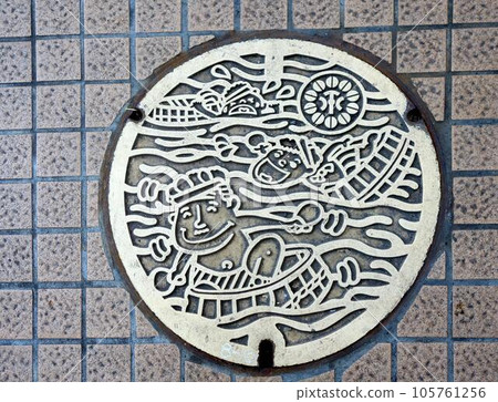 manhole cover and tile walkway 105761256