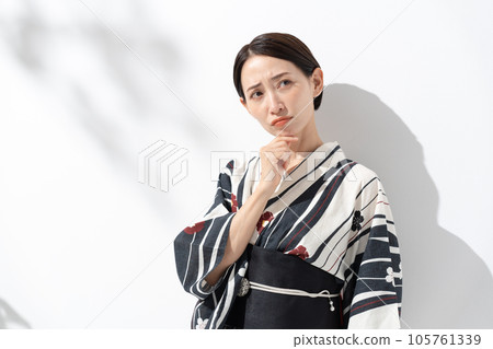 A woman in a yukata worries A woman in a yukata worries 105761339
