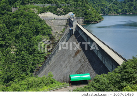 Okutadami Dam towering over steep mountains Okutadami Dam towering over steep mountains 105761486