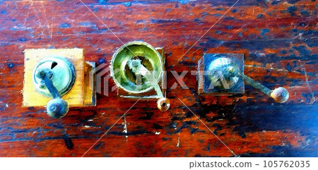 Antique coffee grinders on the table in the garden. Antique coffee grinders on the table in the garden. 105762035