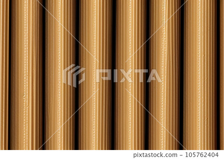 Yellow abstract background with repeating vertical stripes. texture surface Yellow abstract background with repeating vertical stripes. texture surface 105762404