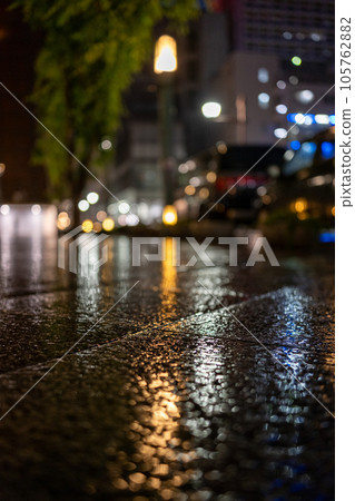 rainy street corner at night 105762882