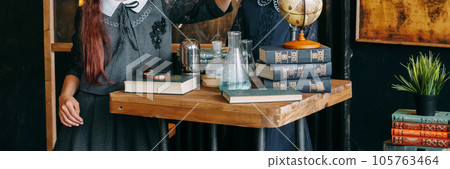 Schoolgirl perform chemical experiments. Back to school. School and preschool education. 105763464