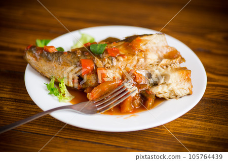 whole fish hake stewed with carrots, beets, peppers and other 105764439