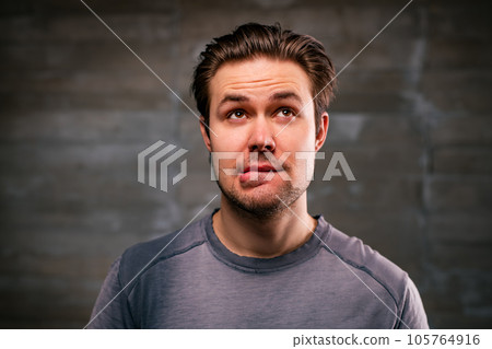 Young doubting man portrait 105764916