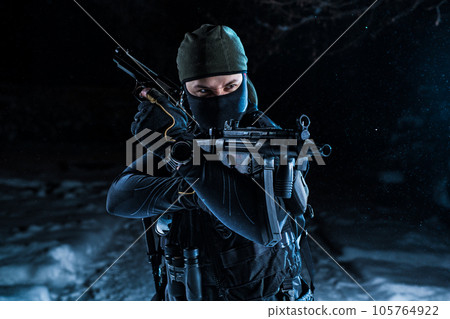 Military man winter posing at night Military man winter posing at night 105764922