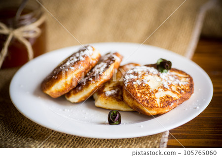 sweet fried cottage cheese pancakes in a plate sweet fried cottage cheese pancakes in a plate 105765060