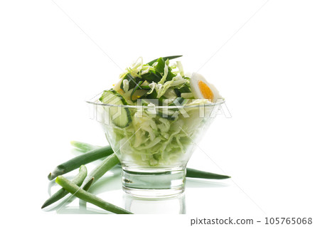 spring salad with early cabbage, cucumbers, eggs and green onions 105765068