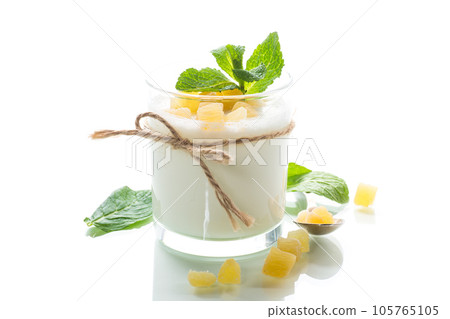 Sweet homemade yogurt with candied fruits in a glass Sweet homemade yogurt with candied fruits in a glass 105765105