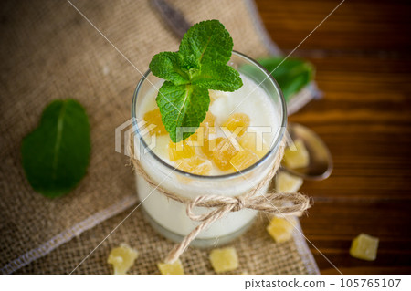 Sweet homemade yogurt with candied fruits in a glass 105765107