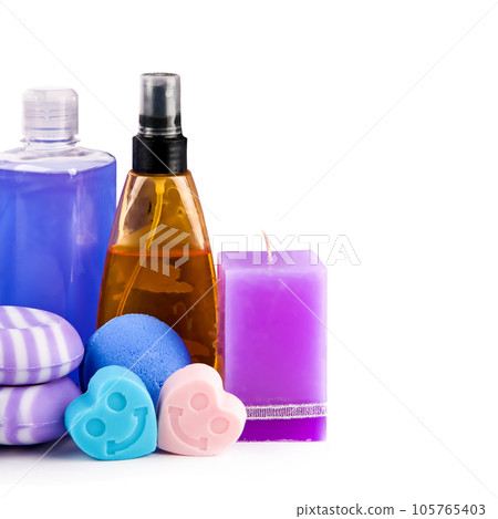Lavender shampoo, soap and scented candles isolated on white . Free space for text. Lavender shampoo, soap and scented candles isolated on white . Free space for text. 105765403