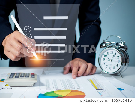 Businessman use electronic pen sign signature on electronic E-signing, data sheet document management, Electronic signature and paperless office concept. 105765419
