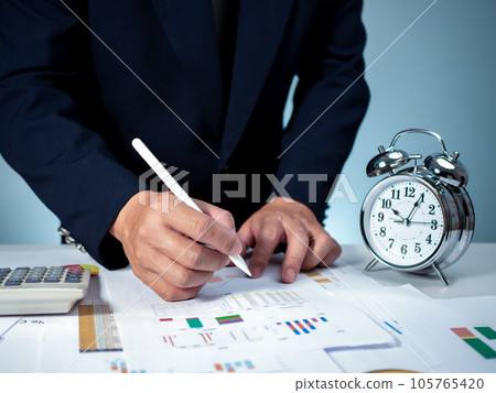 Businessman calculating income To fill out an online personal income tax return form to pay taxes. Financial research. Report. Tax return. Calculation. Businessman calculating income To fill out an online personal income tax return form to pay taxes. Financial research. Report. Tax return. Calculation. 105765420