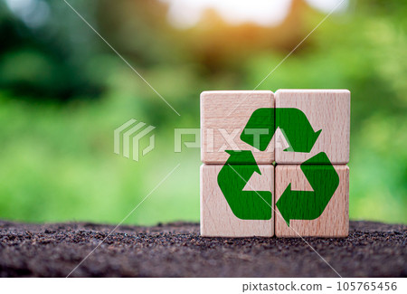 Concepts of waste reduction, pollution, reuse, efficient use of resources. Environmental protection sign by recycling on circular wooden blocks on nature background. 105765456