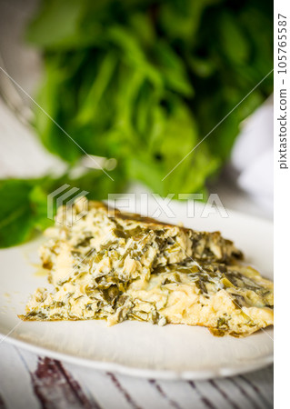 fried egg omelet with spring sorrel inside fried egg omelet with spring sorrel inside 105765587