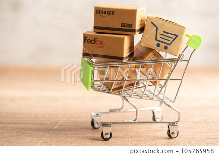 Bangkok, Thailand September 26, 2022 Shopping cart with DHL Amazon and FedEx express packing box, import export online exchange investment business. Bangkok, Thailand September 26, 2022 Shopping cart with DHL Amazon and FedEx express packing box, import export online exchange investment business. 105765958