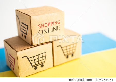 Box with shopping online cart logo and Ukraine flag, Import Export Shopping online or commerce finance delivery service store product shipping, trade, supplier concept. Box with shopping online cart logo and Ukraine flag, Import Export Shopping online or commerce finance delivery service store product shipping, trade, supplier concept. 105765963