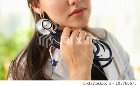 Female doctor hand hold phonendoscope in medical 105766673