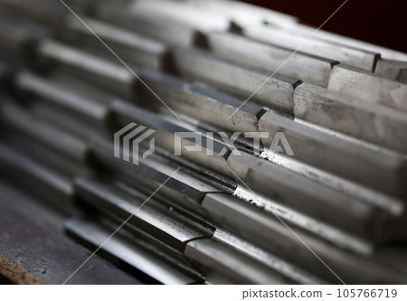 Closeup of metal cogwheel on dark background as part of full machine 105766719