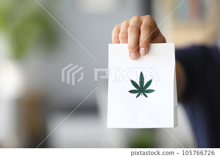 Courier hand passing package with marijuana 105766726