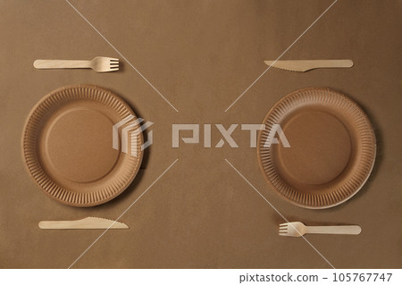 Eco friendly disposable tableware. Biodegradable craft dishes. Recycling concept. Also used in fast food, restaurants, takeaways, picnics. Close-up. 105767747