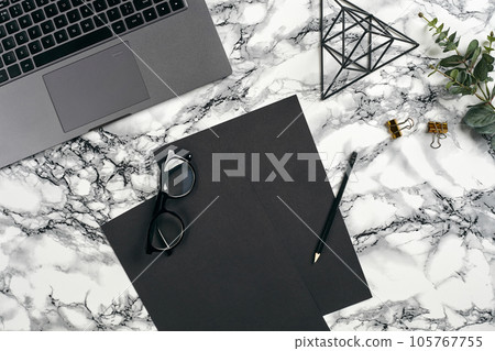 Top view in focus with different office equipment, supplies, stationery. Marble table with copy space. Education, workplace background. Close-up. Top view in focus with different office equipment, supplies, stationery. Marble table with copy space. Education, workplace background. Close-up. 105767755
