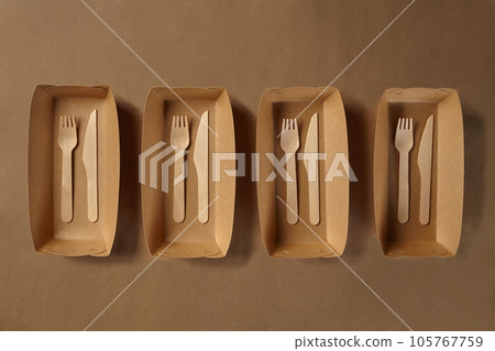 Eco friendly disposable tableware. Biodegradable craft dishes. Recycling concept. Also used in fast food, restaurants, takeaways, picnics. Close-up. 105767759