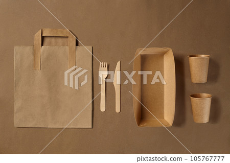 Eco friendly disposable tableware. Biodegradable craft dishes. Recycling concept. Also used in fast food, restaurants, takeaways, picnics. Close-up. 105767777