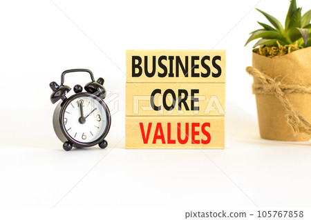 Business core values symbol. Concept words Business core values on wooden block. Beautiful white background. Black alarm clock. Business motivational business core values concept. Copy space. Business core values symbol. Concept words Business core values on wooden block. Beautiful white background. Black alarm clock. Business motivational business core values concept. Copy space. 105767858