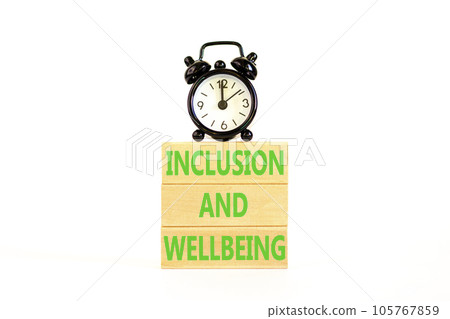 Inclusion and wellbeing symbol. Concept words Inclusion and wellbeing on wooden block. Beautiful white table white background. Black alarm clock. Motivational inclusion wellbeing concept. Copy space. 105767859