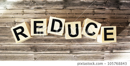reduce, reuse and rework a word written on a wooden block. 105768843