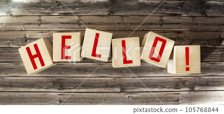 Word Hello from wooden letters on wooden background 105768844