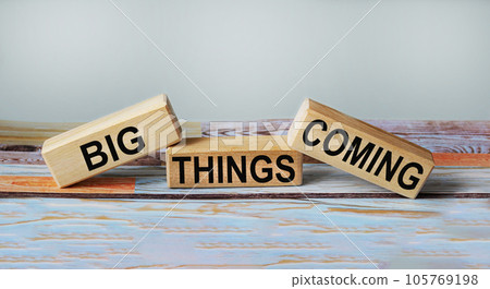 BIG THINGS COMING text on wooden blocks and vintage background BIG THINGS COMING text on wooden blocks and vintage background 105769198