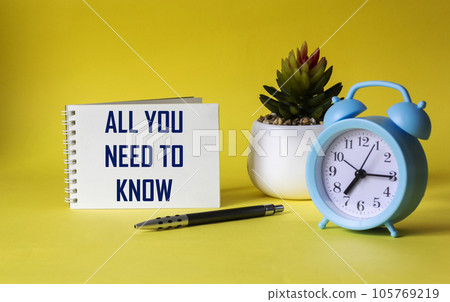 Everything you need to know. Motivation quote on notepad and yellow background Everything you need to know. Motivation quote on notepad and yellow background 105769219