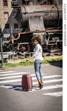 Woman with suitcase 105769553