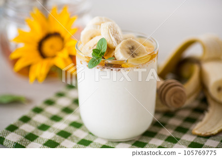 Sweet homemade yogurt with bananas and honey Sweet homemade yogurt with bananas and honey 105769775