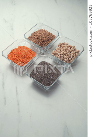 Four different types of cereals: buckwheat, nohut ,red lentils, chia seed.close up. flat lay 105769923