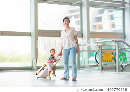 Family in airport. Kids fly. Travel with child. Family in airport. Kids fly. Travel with child. 105770216