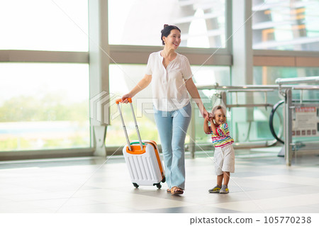 Family in airport. Kids fly. Travel with child. Family in airport. Kids fly. Travel with child. 105770238