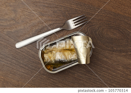 Sardine fishes can and silver fork preserve 105770314