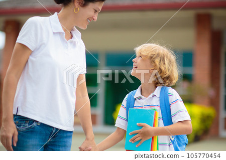 School pick up. Mother and kids after school. School pick up. Mother and kids after school. 105770454