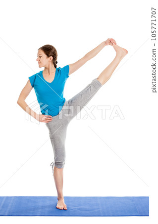 Yoga - young beautiful slender woman yoga instructor doing Extended Hand-To-Big-Toe Pose (Utthita Hasta Padangustasana) asana exercise isolated on white background 105771707