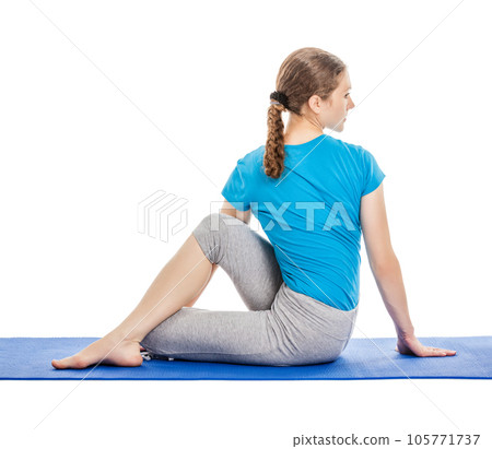 Yoga - young woman yoga instructor doing Half Lord of the Fishes Pose (Half Spinal Twist Pose) (Ardha Matsyendrasana) asana exercise isolated on white background 105771737