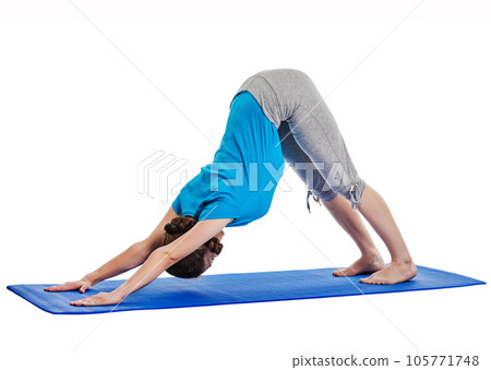 Yoga - young beautiful woman yoga instructor doing Downward Facing Dog (adho mukha svanasana) asana exercise isolated on white background 105771748