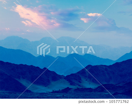 Vintage retro effect filtered hipster style travel image of Himalayas mountains in twilight. Ladakh, Jammu and Kashmir, India Vintage retro effect filtered hipster style travel image of Himalayas mountains in twilight. Ladakh, Jammu and Kashmir, India 105771762