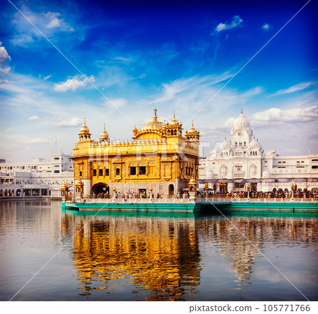 Vintage retro hipster style travel image of famous India attraction Sikh gurdwara Golden Temple (Harmandir Sahib). Amritsar, Punjab, India Vintage retro hipster style travel image of famous India attraction Sikh gurdwara Golden Temple (Harmandir Sahib). Amritsar, Punjab, India 105771766