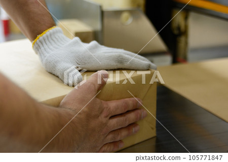 Printing, binding, and packaging work at a printing shop 105771847
