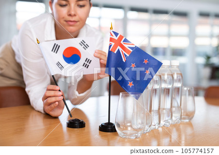 Businesswoman arranging the flags of South Korea and Australia for presentation and negotiations 105774157