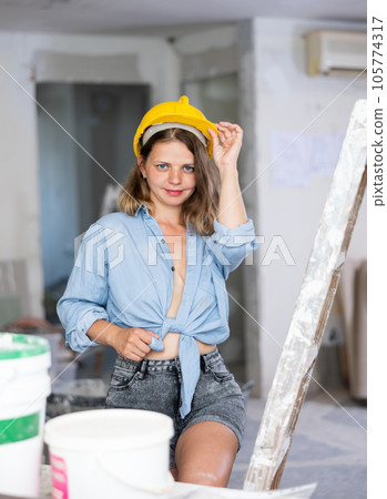 Sexy woman posing in building site Sexy woman posing in building site 105774317